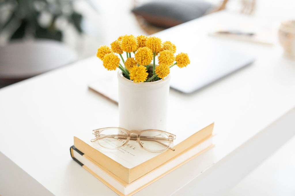 Vase of flowers on a book about email marketing for bloggers